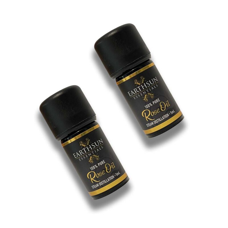 Two bottles of Rose Fragrance Oil | Perfume Oil - 100% Pure, positioned side by side on a plain white background. Each bottle has a black cap and label with gold and white text.