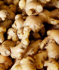 A close-up view of a pile of Organic Ginger Essential Oil - 15ml, ideal for extracting some of the best essential oils.
