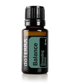 A 15 ml bottle of doterra balance essential oil, a grounding blend, with a dark amber glass and black cap, isolated on a white background. This is one of the popular doterra essential