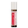 A cylindrical bottle of doTERRA 'Stranger' protective blend essential oil, labeled clearly with red and white designs against a white background, features a rollerball applicator.