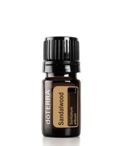 A small brown glass bottle labeled "doterra sandalwood hawaiian" with a black cap, centered against a white background.