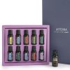 An open Home Essentials Starter Pack Oil Kit - Pack Of 10 Bottles - 15ml Each containing multiple labeled 15ml bottles with a single bottle standing outside against a grey background. The box is purple, and the interior is lined in the