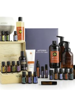 A collection of Nature's Solution Comprehensive Starter Pack branded wellness products including essential oil blends, skincare products, and a wooden box, arranged neatly on a white background.