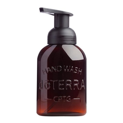A dark amber glass bottle with a black pump dispenser labeled "hand wash dōterra cptg essential oil blends," standing against a white background.