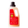 A bottle of On Guard® All Natural Softgel Beadlets laundry detergent, featuring a red label. The bottle is transparent, showcasing the yellowish liquid inside, and is designed to handle up to 64 loads.
