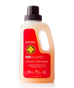 A bottle of On Guard® All Natural Softgel Beadlets laundry detergent, featuring a red label. The bottle is transparent, showcasing the yellowish liquid inside, and is designed to handle up to 64 loads.