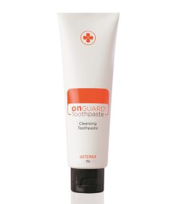 A tube of On Guard® Natural Whitening Cleansing Toothpaste by doTERRA, presented upright against a white background. The packaging is white and orange with the brand logo at the top.