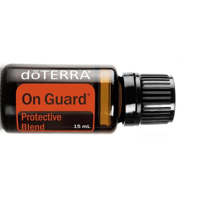 A bottle of dōTERRA On Guard protective blend essential oil, 15 ml size, with a black cap and orange label, centered on a white background.
