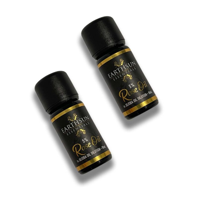 Two small bottles of Perfume Oil – 100% Pure | 5% Dilution in Jojoba Oil on a white background. The labels are black and gold, and each bottle has a black cap. The bottles contain 0.24 oz